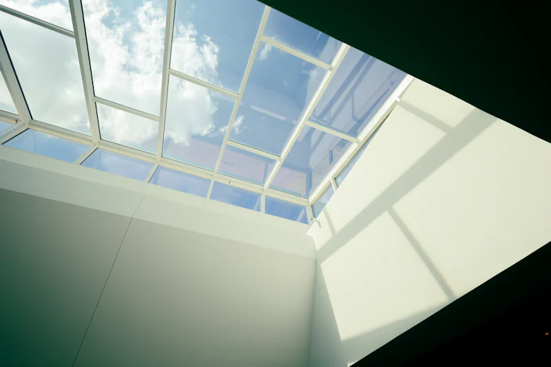 Skylight letting daylight into a room with white walls